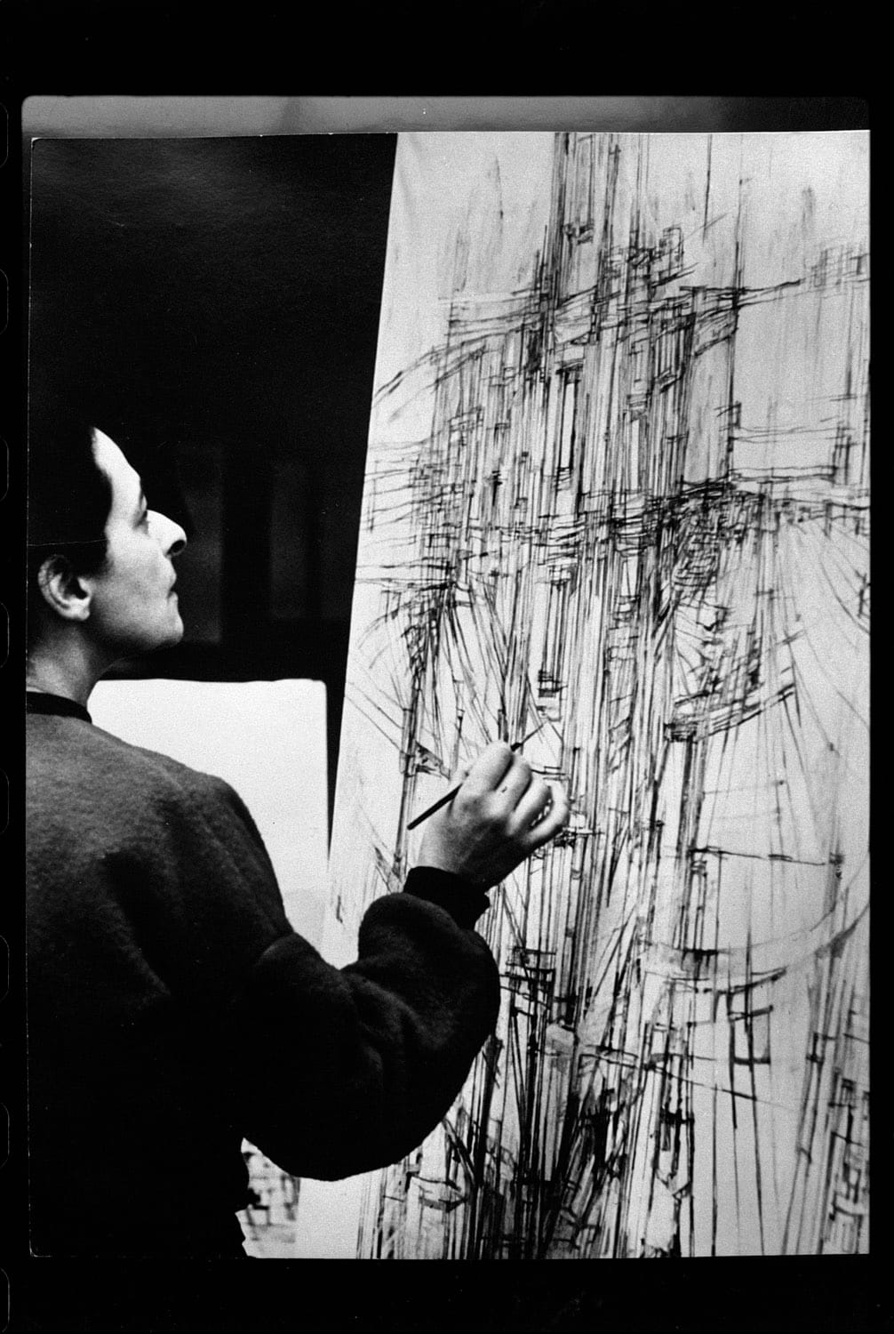 Maria Helena Vieira da Silva en train de peindre, par Denise Colomb