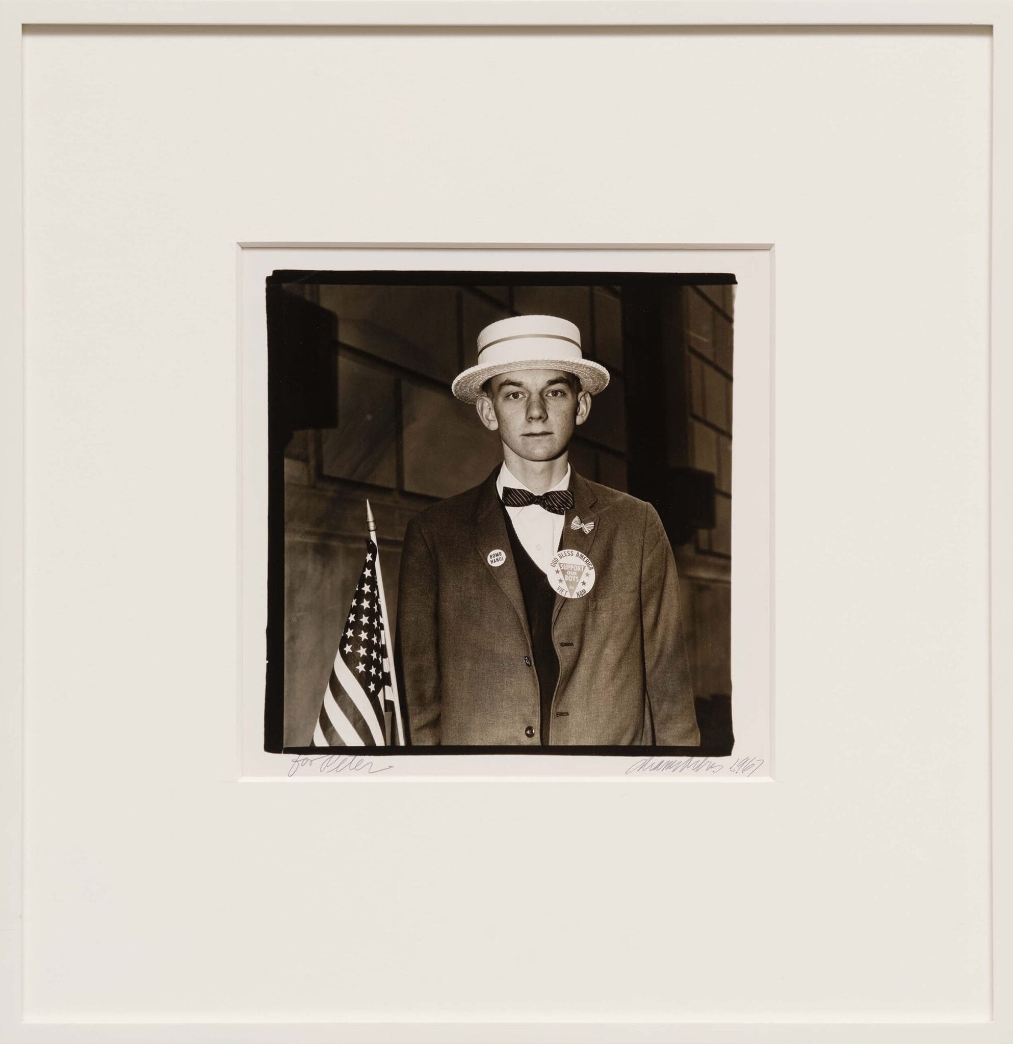 Diane Arbus, Boy with a Straw Hat Waiting to March in a Pro-War Parade, N.Y.C., 1967
