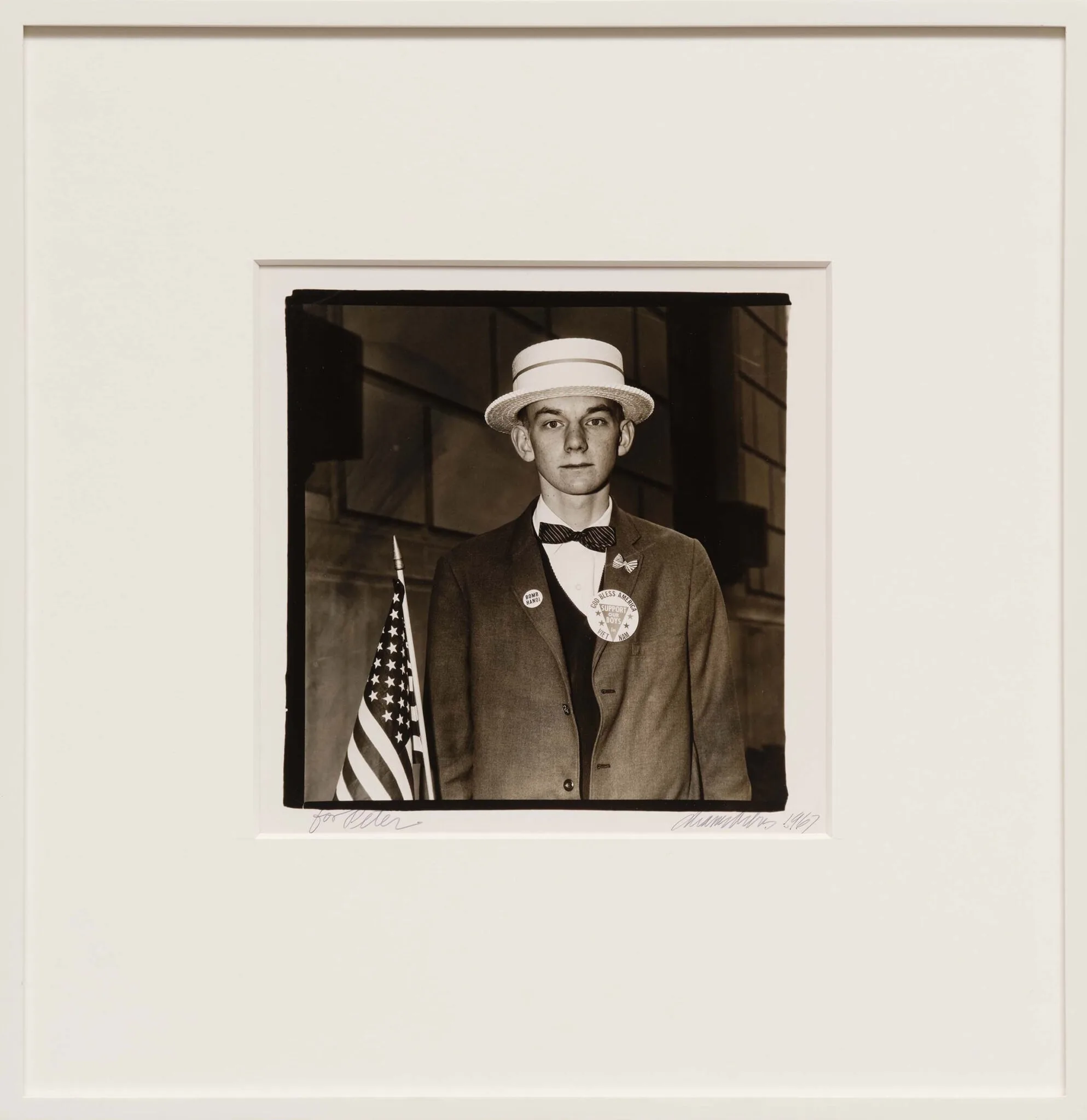 Diane Arbus, Boy with a Straw Hat Waiting to March in a Pro-War Parade, N.Y.C., 1967