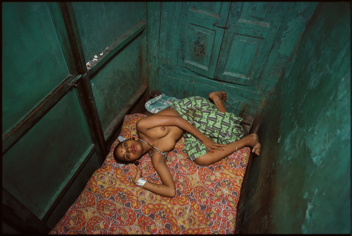 Mary Ellen Mark, Twelve-year-old Lata lying in bed, Falkland Road, Bombay, India, 1978